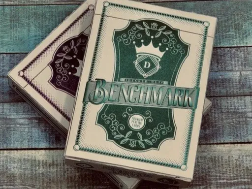 Bench Mark Playing Cards is a collaboration between Decked Out Cards and Eight High Studios and comes in Purple and Teal.The Bench Mark deck of playing cards is a deck that could appeal to everyone-