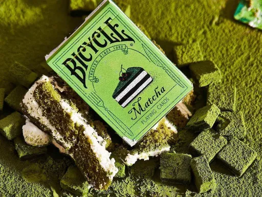 Bocopo presents Bicycle Matcha Playing Cards, a deck of Matcha Cake themed playing cards that will make you want to satisfy your sweet tooth! The back design is divided into slices of cake, with light