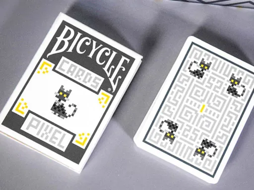 After more than a year of artistic effort, the Bicycle Pixel Playing Cards are finally here! The design features a pixelated cartoon style with the main elements being a puppy and kitty. All of the