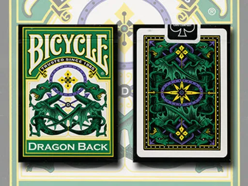 The Bicycle® Green Dragon Back decks feature a detailed, mirror-image dragon design, as well as a vivid color scheme that includes shades of deep green, purple, and yellow. The red suits and pips feature deeper