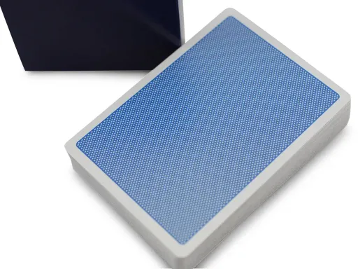 Created by the Bocopo Playing Card Company, the Blue Steel playing cards feature a minimalist design with a simple dot pattern and a thin white border. They are perfect for magicians and cardists. Printed by