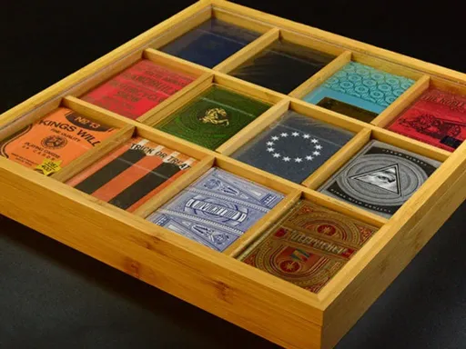 The Carat Twelve Deck Stackable Bamboo Tray w/Lid allows you to display 12 of your favorite decks in three rows of four. It is made of Eco-friendly, sustainably sourced natural bamboo coated with an environmentally