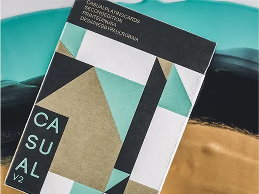 The second edition of Casual Playing Cards have arrived! Designed by Paul Robaia, the back design boasts a beautiful geometric design with a variety of Pantone colors: metallic gold, mint green, white, and black. The