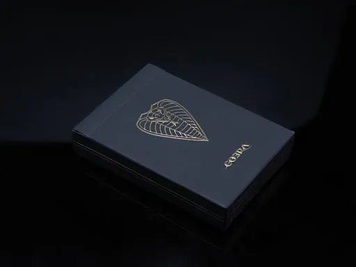 The infamous COBRA deck is now in Black! Designed by the talented artist Rick Davidson, COBRA Black Edition Playing Cards are sleek, classy, and luxurious. The card backs and fronts feature gold metallic inks and