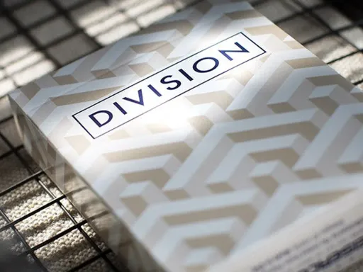 Division Playing Cards is ideal for cardists and magicians alike who play with perceptions.These cards are a geometric collection of shapes celebrating the artist, Escher, and his concepts of cubic space division (hence the name).