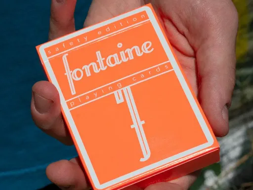 Fontaine: Safety Playing Cards are the third release of the NEON Pantone Fontanes. Bright construction orange, they attract attention for any collector, cardist or magician's hands. Two way back design with the classic Fontaine "f".