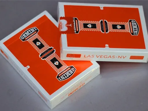 Designed by Toomas Pinston, Gemini Casino Orange playing cards are inspired by timeless classics such as Dunes Casino and Jerry's Nugget playing cards. The back design features a vibrant orange color along with a mirrored