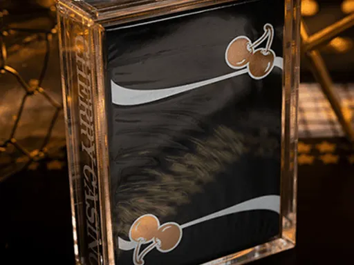 Gold gilding. Numbered seals.Special tuck.Enclosed in carat case for your collection.Only ELITE magicians and collectors worldwide will have a Limited Edition Cherry Casino Gilded (Monte Carlo Black and Gold) Playing Card deck. Even James Bond