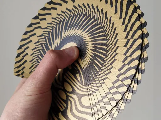 Designed by Toomas Pintson, Gold Goblin Playing Cards by Gemini were created to take your cardistry fanning skills to the next level! The borderless back design features a shiny metallic gold and black colorway, with