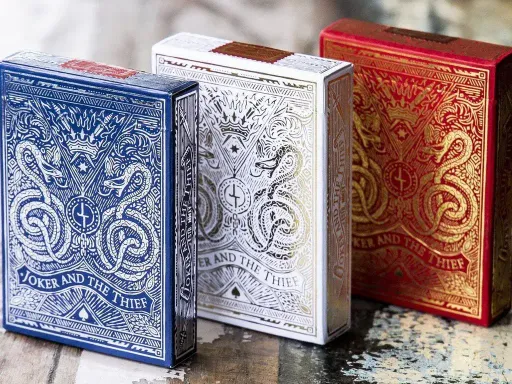 The Joker and the Thief series illustrates strong contrasting themes of life and death, good and evil, lightness and darkness, and love. The back design is very intricate and unique, with the King and Joker