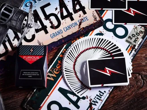 This deck takes inspiration from the amazing thriller The Fast and The Furious. The back design instills excitement and thrill with a lighting bolt and is amazing for cardistry. The classic color combination of red,