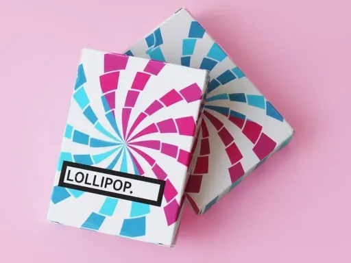 Riffle Shuffle in collaboration with Flaminko Playing Cards present Lollipop Playing Cards. This deck was inspired by the mesmerizing swirls of a lollipop. The fun and bright colors create flamboyant Cardistry and Magic routines. Printed