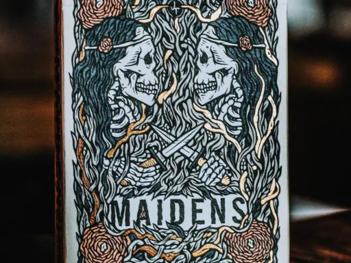 The latest edition of the Maidens Playing Cards, tendrils of copper foil are stamped into the back design. This process, known as cold foil stamping, results in a glistening effect, as if metal had been