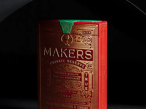 Luxury playing cards brought to life by The D&amp;D Playing Card Co., MAKERS Private Reserve is the most intricate deck in the collection, featuring an ornate foil-stamped back design set against a maroon backdrop. Each