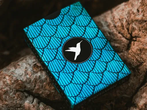 The Hummingbird Feathers playing cards by Marvelous Decks are luxurious playing cards that feature holographic properties making it one of the most beautiful playing cards on sale today.The Blue Marvelous Hummingbird Feathers Playing Card decks