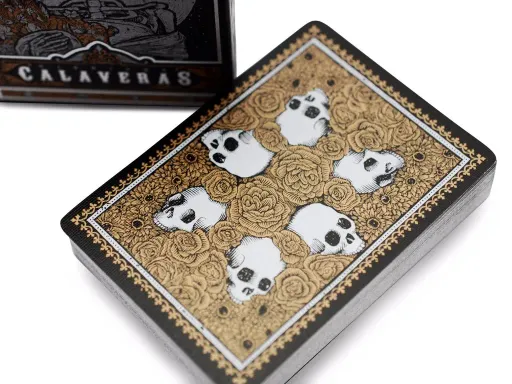 Created by Chris Ovdiyenko and funded on Kickstarter, the unbranded Midnight Calaveras deck is a darker rendition of the Classic Calaveras playing cards. Printed by USPCC, these cards feature metallic printing against a black background,