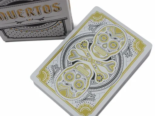 Produced by USPCC and designed by Steve Minty, the Muertos Mourning Gold deck is an original celebration of life and death. Portraying Dia De Los Muertos, the famous Mexican celebration, the deck brings together tradition,