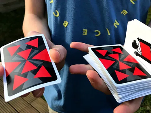 Nyx Reds Playing Cards are uniquely designed with red, black, and grey geometrical patterns that when combined together present a gorgeous back design that is perfect for Cardistry and Magic. The equilateral triangles in the