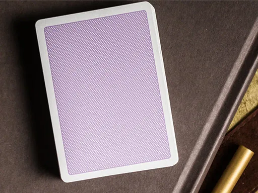 Created by the Bocopo Playing Card Company, the Purple Steel playing cards feature a minimalist design with a simple dot pattern and a thin white border. They are perfect for magicians and cardists. Printed by