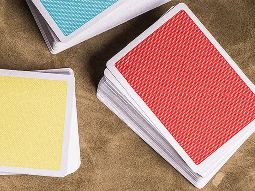 Created by the Bocopo Playing Card Company, the Red Steel playing cards feature a minimalist design with a simple dot pattern and a thin white border. They are perfect for magicians and cardists. Printed by