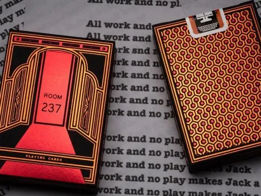 The dynamic orange, brown and red colors of the limited edition Room 237 playing card decks by Penguin Magic are mesmerizing and the deck has 100% custom artwork on all 52 playing cards with original