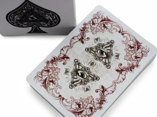 Rorrison's Sinners playing cards are a traditional deck with intricate design patterns inspired by Masonry art and symbolism. The back of the playing cards showcases two large 'all-seeing eyes,' a common symbol of Masonry. The