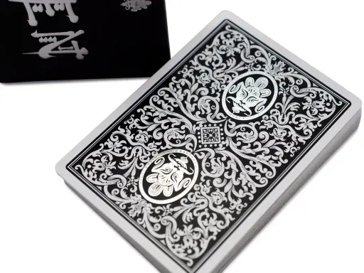 After years of experimentation and assiduous work, EPPC finally released the Royal ZEN deck. The deck boasts a sideways tuck case with lavish embossing, glistening silver foil, and a high quality matte black paper stock.