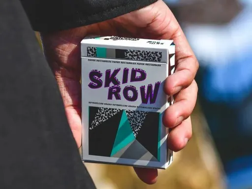 Skid Row Playing Cards by Gemini Playing Cards is a deck that focuses on cardistry which has geometric and retro artwork which takes you back into the 90's.The Skid Row playing cards include 2 custom