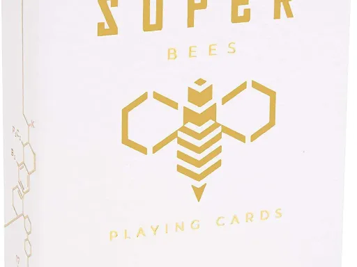 Super Bees Playing Cards were created to protect bees and help their population thrive. The gold hexagonal back design is the same as the infamous Killer Bees deck, but the colorway is now white. The