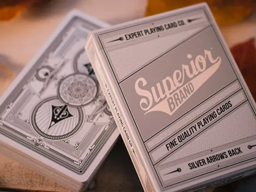 Designed by the talented Jackson Robinson, Superior Silver Arrow Playing Cards feature an intricate silver and white back design, and the classic Superior tuck box. The elegant back design is perfect for Cardistry, Magic, and