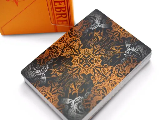 Presenting ZUCCA, the newest installment in the acclaimed TENEBRE series. This Orange edition is a highly exclusive signature playing card deck from 4PM DESIGNS. Initially, 120 of these decks were launched on Kickstarter by 4PM