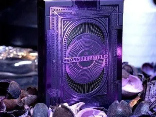 The Constellation Playing Cards by DECKIDEA features a highly detailed design of the constellations and the Mystique Purple version is made with purple foil on top of a dark purple card.The tuck box of the