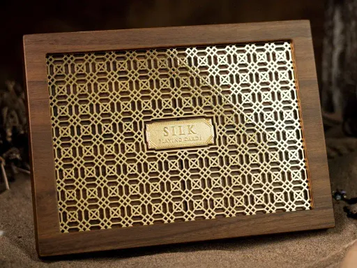 The Silk Wooden Boxset is the most luxurious variant in the Silk Series by Ark Playing Cards.Apart from the tuck boxes being made of Silk Fabric, the Silk Playing Cards come with a collector's box