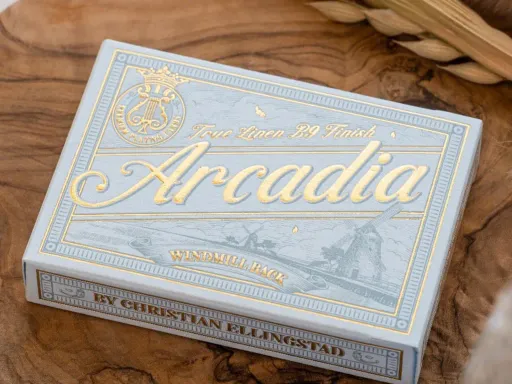 The Arcadia Azure Blue Windmill Back Playing Cards are inspired by early 1920's Vintage card back designs and old stamps. The Windmill Back cards are housed in an elegant tuck box that is letterpressed and